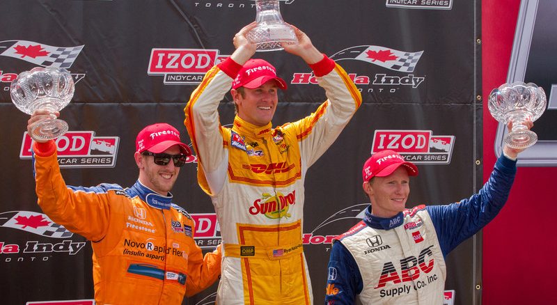 Ryan Hunter-Reay (centre), Charlie Kimball (left) and Mike Conway (right) stand on the podium at Honda Indy Toronto on Sunday afternoon (JP Dhanoa)